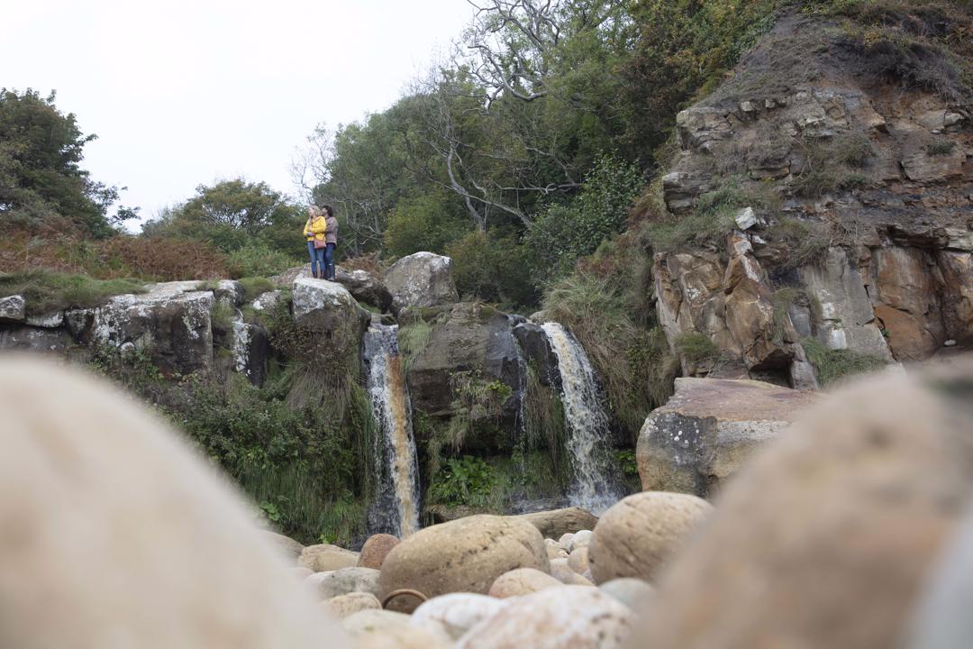 Couple on top of waterfall