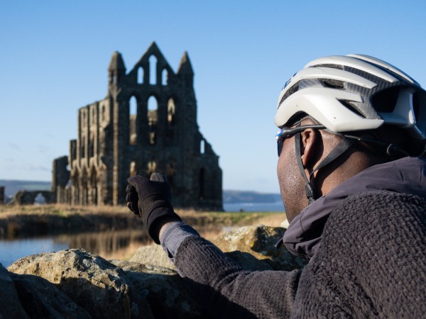 Cycling past Whitby Abbey